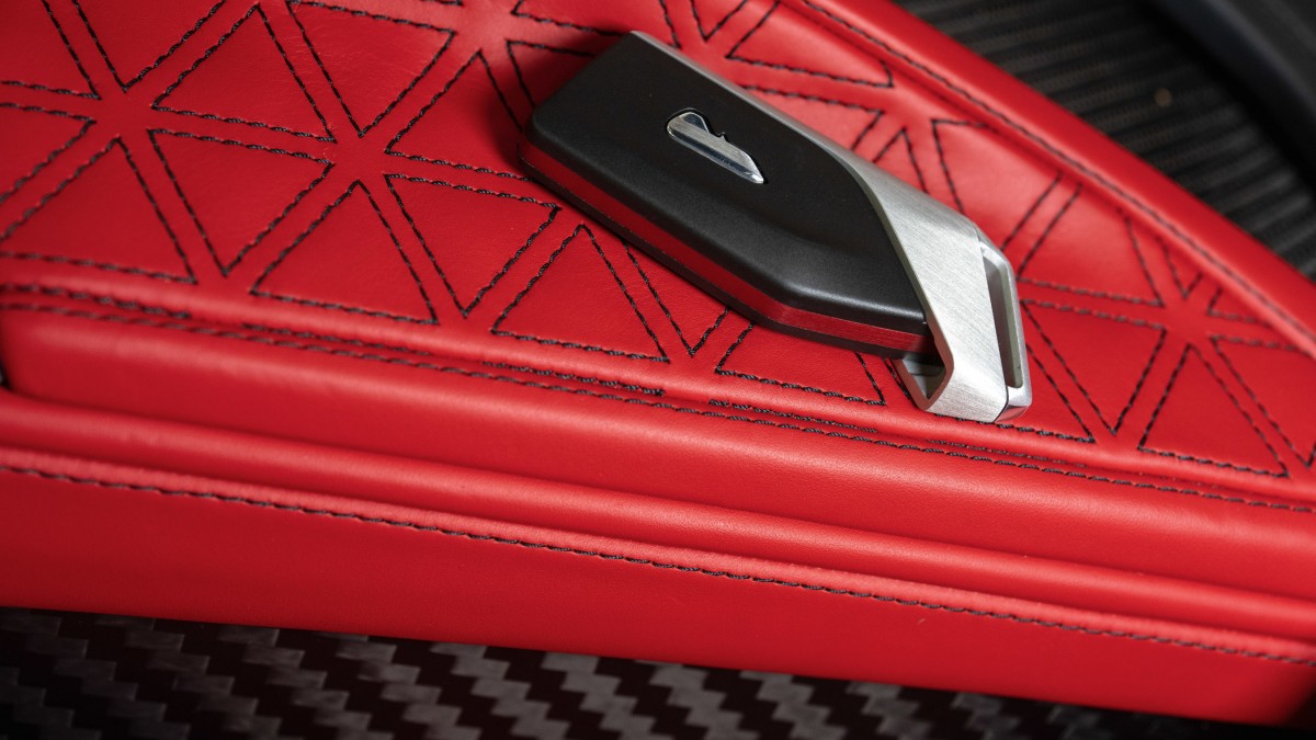 Even the key is unique - with a red-anodised aluminum accent to match the interior