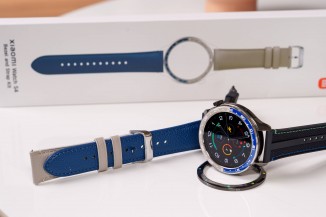 The additional camera bezel and leather strap