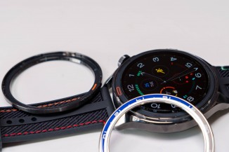 The additional camera bezel and leather strap